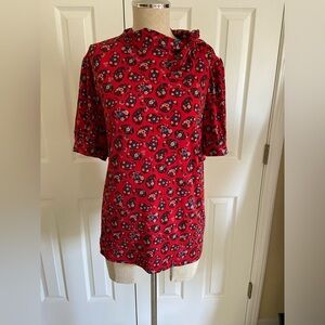 Gorgeous woman’s blouse with tie detail!